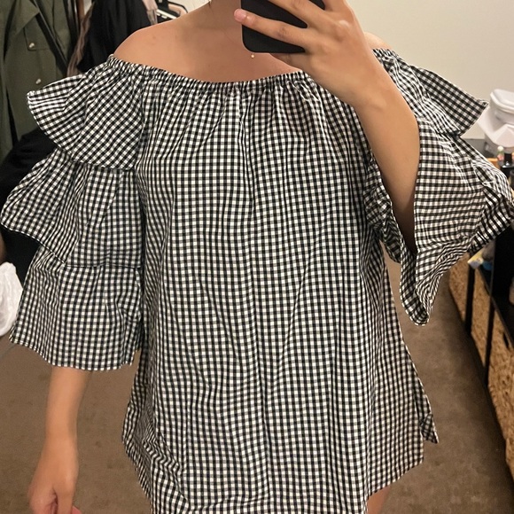 Tops - Women’s top with flared triple sleeves.